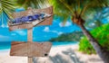 Ãâ¢mpty blank wooden signs or billboard for text with view of the Ãâropical beach , selective focus